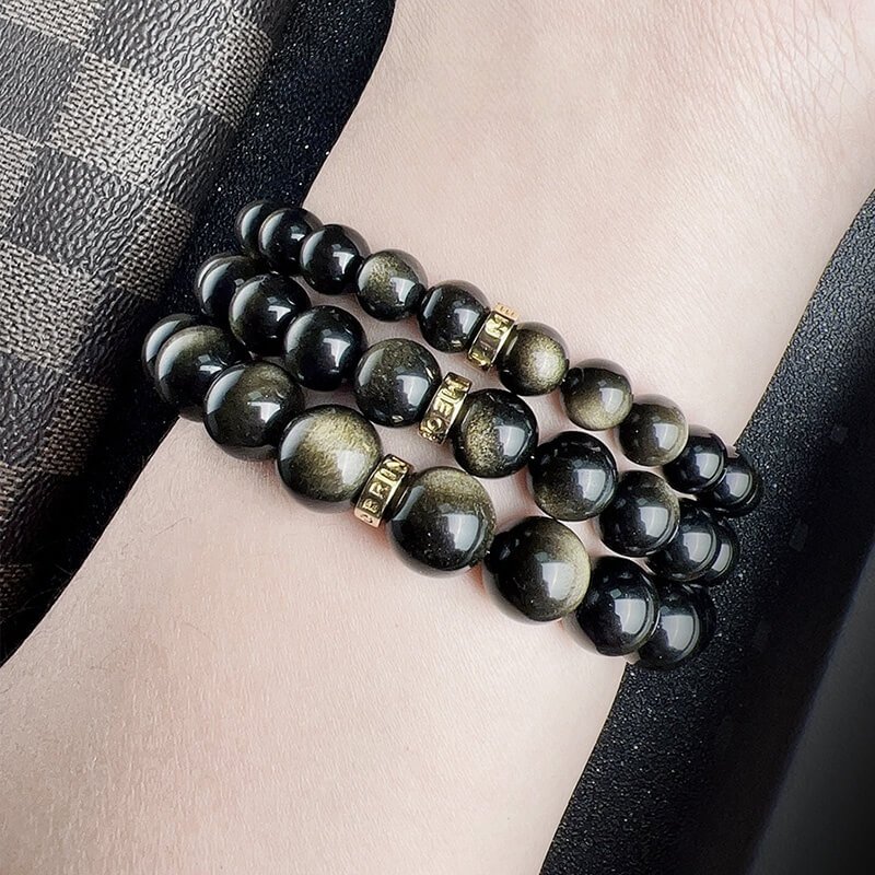 Size comparison of 12mm, 10mm, and 8mm Gold Sheen Obsidian beads for personalized fit and style