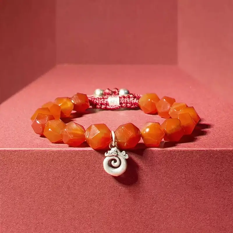 Close-up of 8mm Red Agate beads with natural flame-like patterns for vitality and positive energy