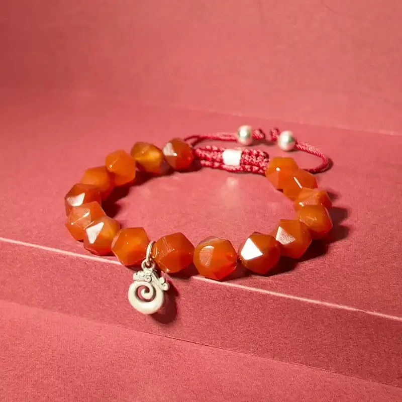 Detail of 925 Silver flame patterns for aura purification and chakra balance in Red Agate bracelet