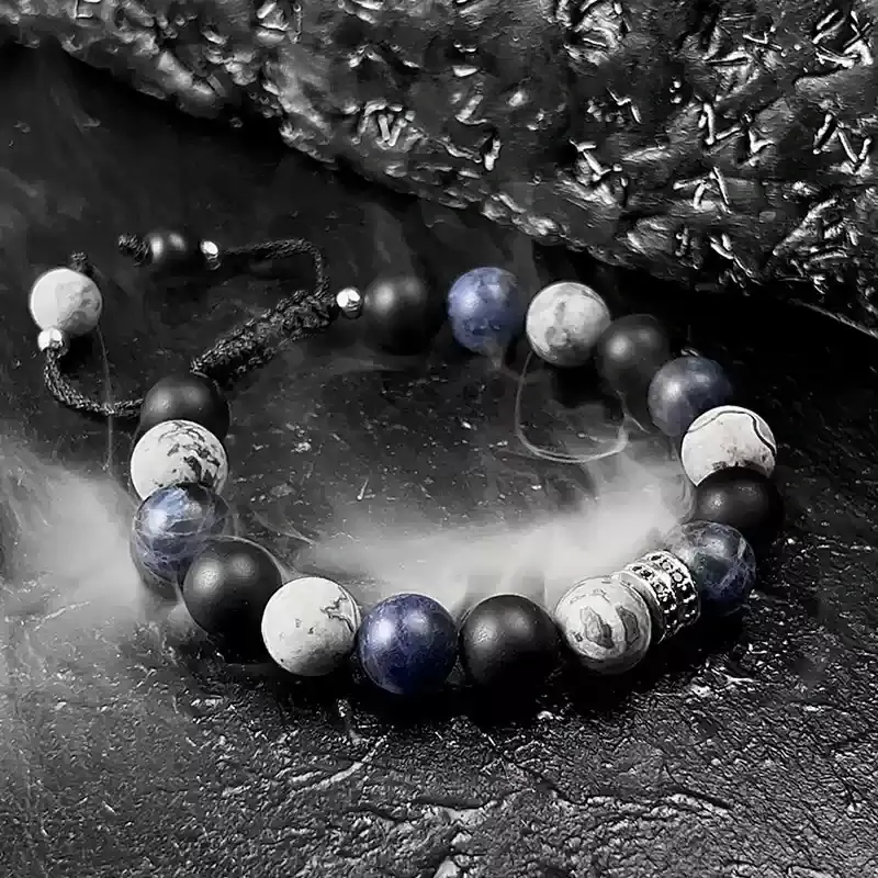 Close-up of Black Agate and Blue-veined Stone beads for negative energy protection and Throat Chakra tranquility