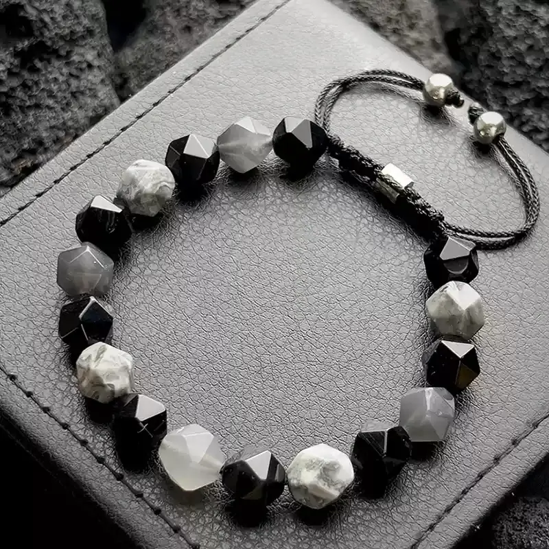Close-up of Black Agate’s matte surface for Root Chakra stability and negative energy shielding