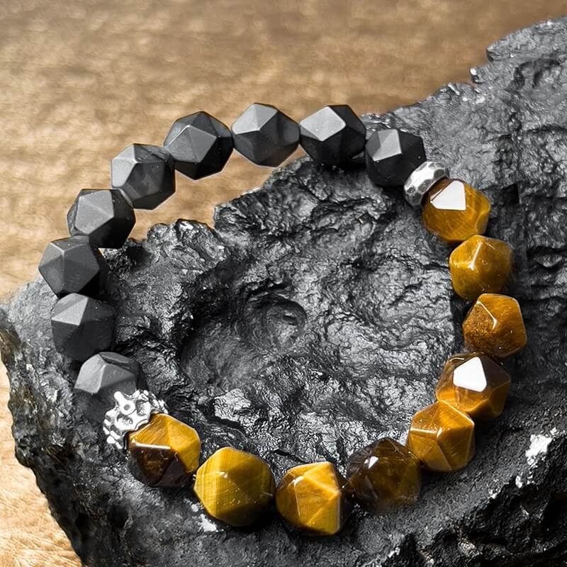 Close-up of Black Agate’s smooth matte surface for Root Chakra security and negative energy absorption