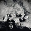 Crown to Root chakra energy flow diagram with White Crystal and Obsidian, harmonizing spirituality and grounding