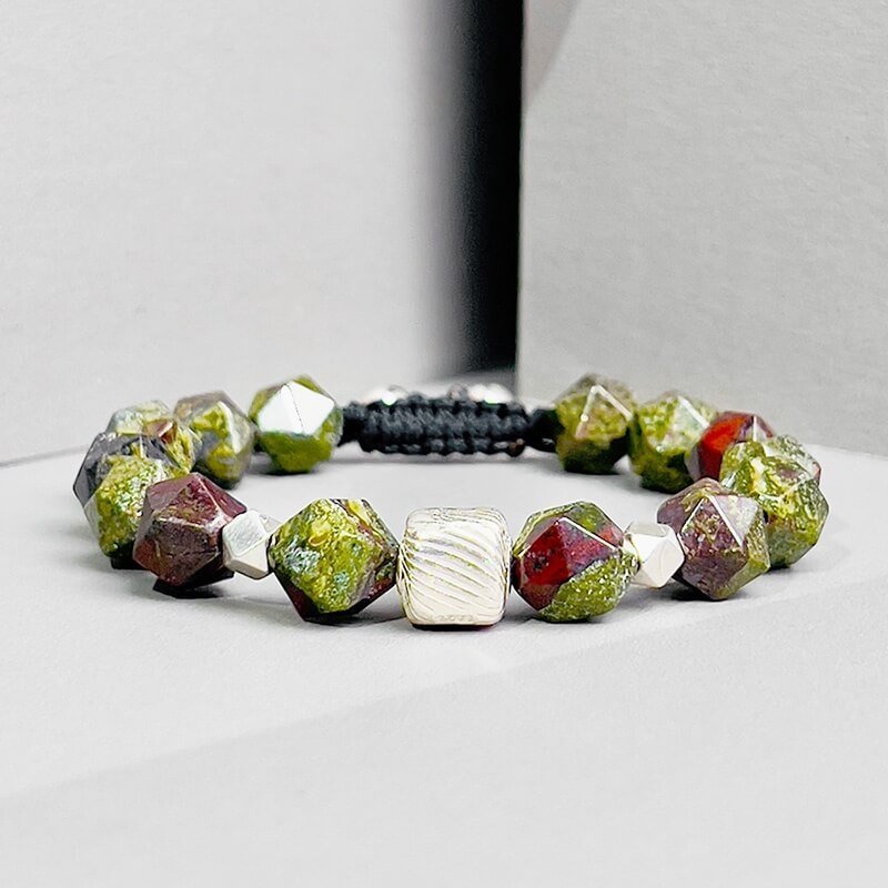 Close-up of Dragon Blood Stone’s fiery texture and 925 Silver ancient runes for protective energy and Root Chakra stabilization