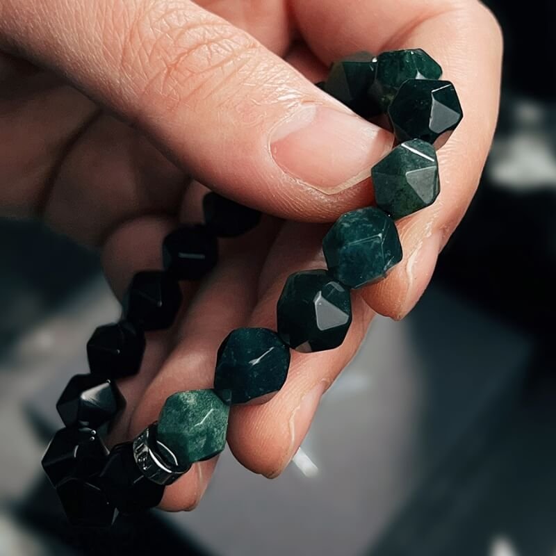 Woman in business attire wearing Black Agate bracelet for Root Chakra calm and Heart Chakra focus at work