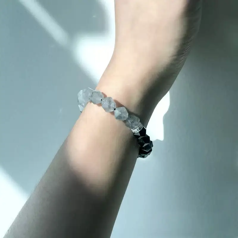 Woman in business attire wearing Cloud Crystal bracelet for Crown Chakra focus and Root Chakra stress protection