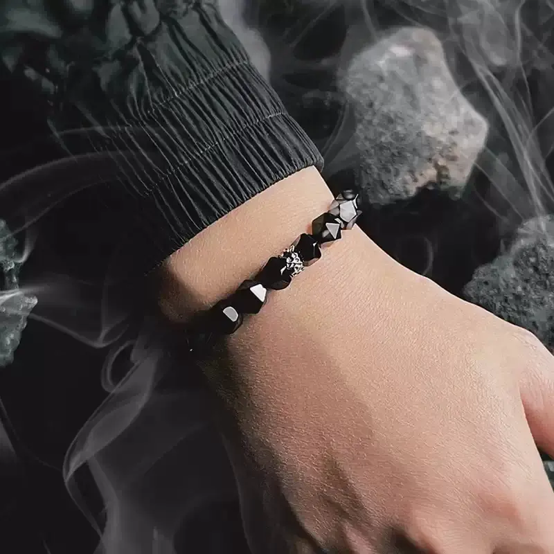 Male model wearing dark style gradient Black Agate bracelet for cosmic energy and masculine strength