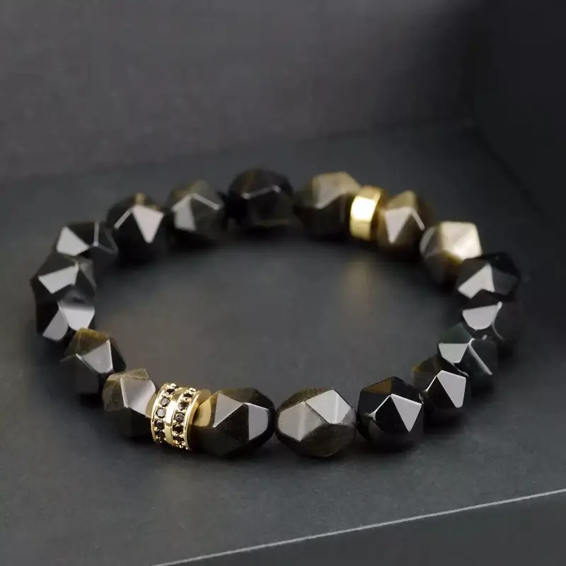 Man in business suit wearing Gold Sheen Obsidian bracelet for Root Chakra confidence and prosperity at work