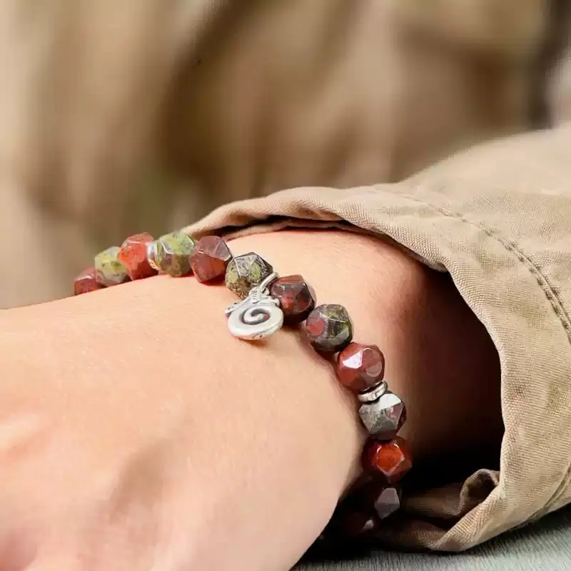 Man in gothic style wearing Dragon Guardian bracelet for courage and chakra balance