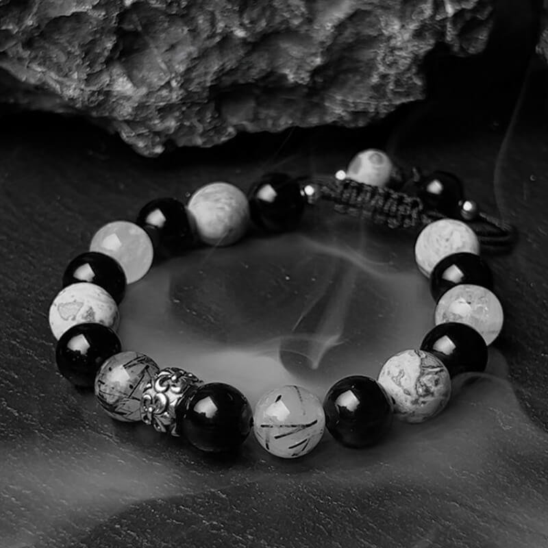 Man in gothic attire wearing Black Rutilated Quartz bracelet for Root Chakra confidence and dark spiritual style
