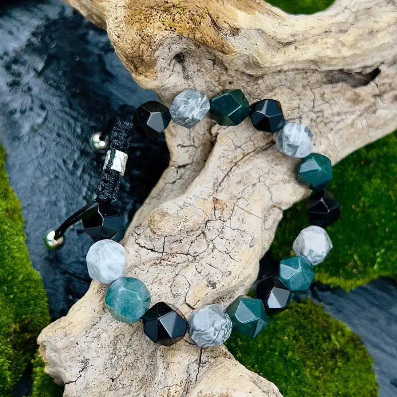 Man wearing Map Stone bracelet at work for Throat Chakra articulation and professional confidence