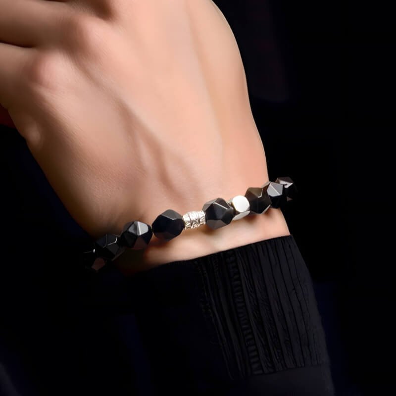 Men’s obsidian bracelet in L size (6.7–7.1") – Root Chakra stability enhances professional confidence and stress relief.