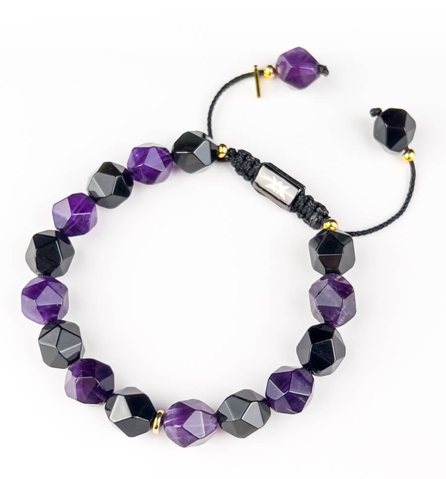 Close-up of 10mm Obsidian (black) and Amethyst (purple) beads – natural textures symbolizing protection and spiritual wisdom.