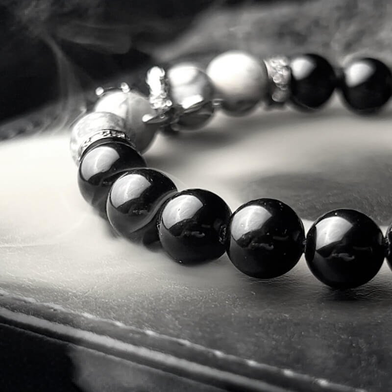 Close-up of Obsidian’s smooth matte surface for Root Chakra protection and negative energy absorption