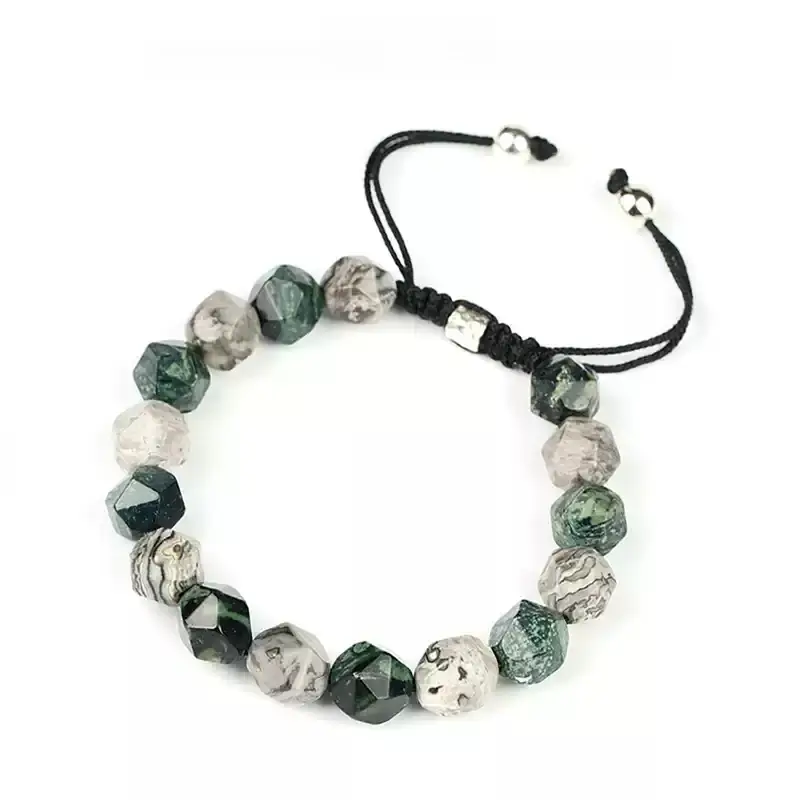 Woman in office wearing Map Stone bracelet for Throat Chakra articulation and strategic communication
