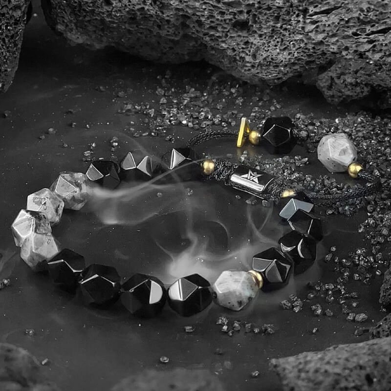 Person hiking with Black Agate bracelet for Root Chakra courage and negative energy shielding
