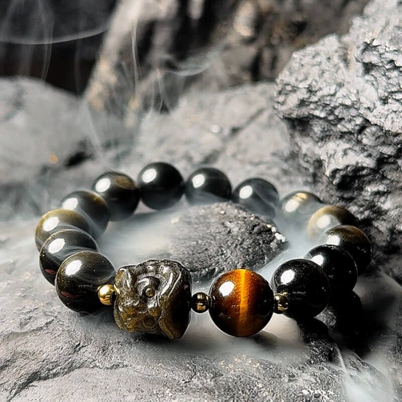 Obsidian beads aligned with Root Chakra – absorbs negative energy and stabilizes foundational security for men.
