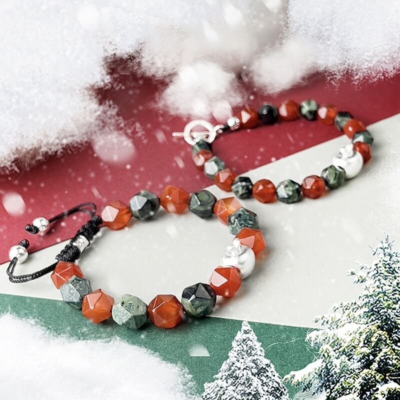 Detail of silver apple charm symbolizing Christmas peace and protection, enhancing festive bracelet design