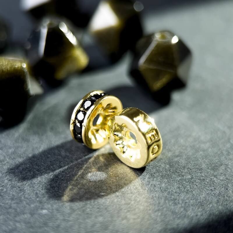 Detail of customizable silver engraving on Gold Sheen Obsidian bracelet for unique protective energy jewelry