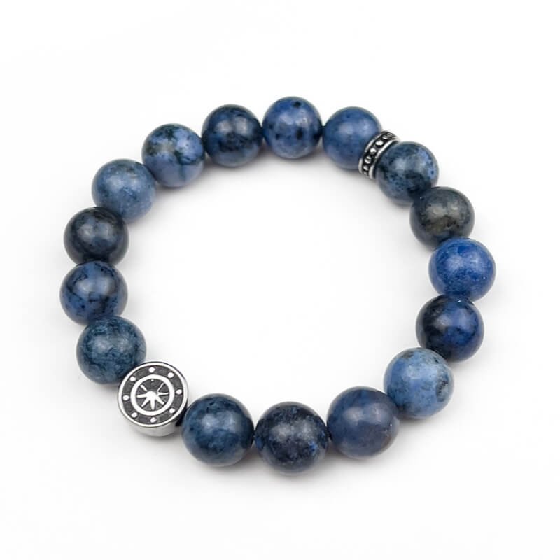 Dumortierite bracelet aligned with Throat Chakra symbol – balances energy for clear communication and spiritual connection.