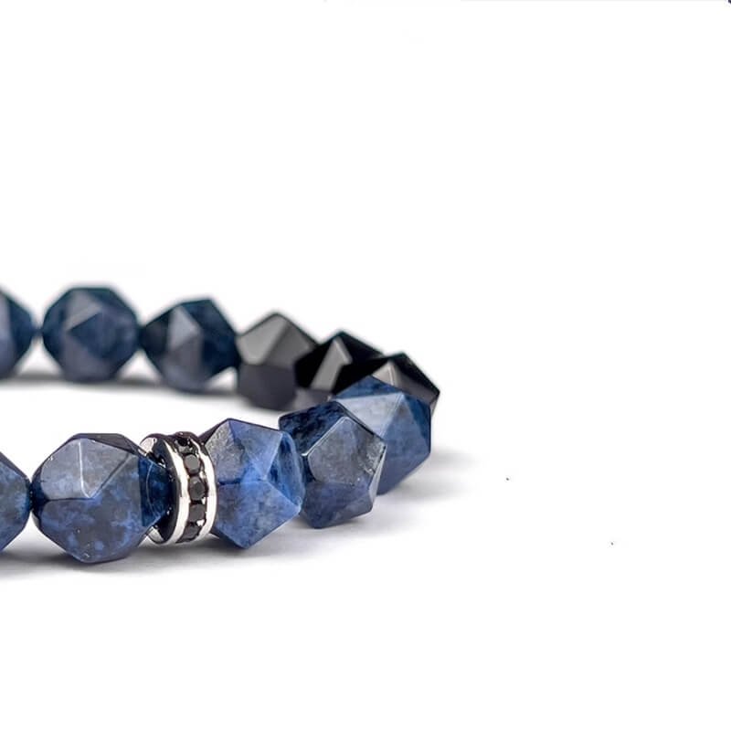 Throat to Root chakra energy flow diagram with Dumortierite and Black Agate, balancing expression and grounding