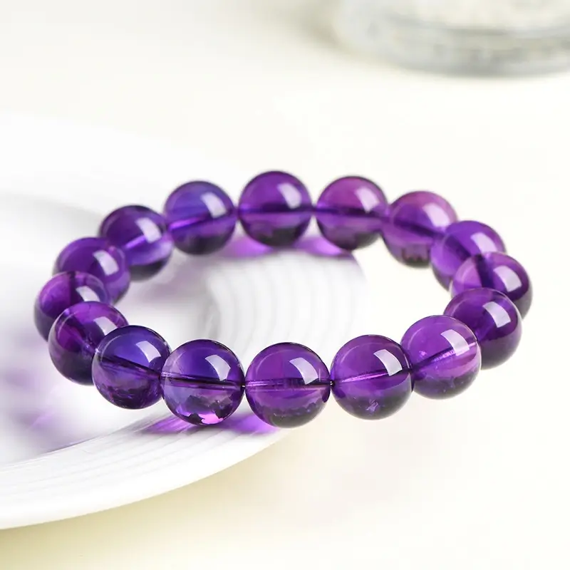 Detail of handwoven 9mm Uruguayan amethyst beads, showcasing artisanal craftsmanship