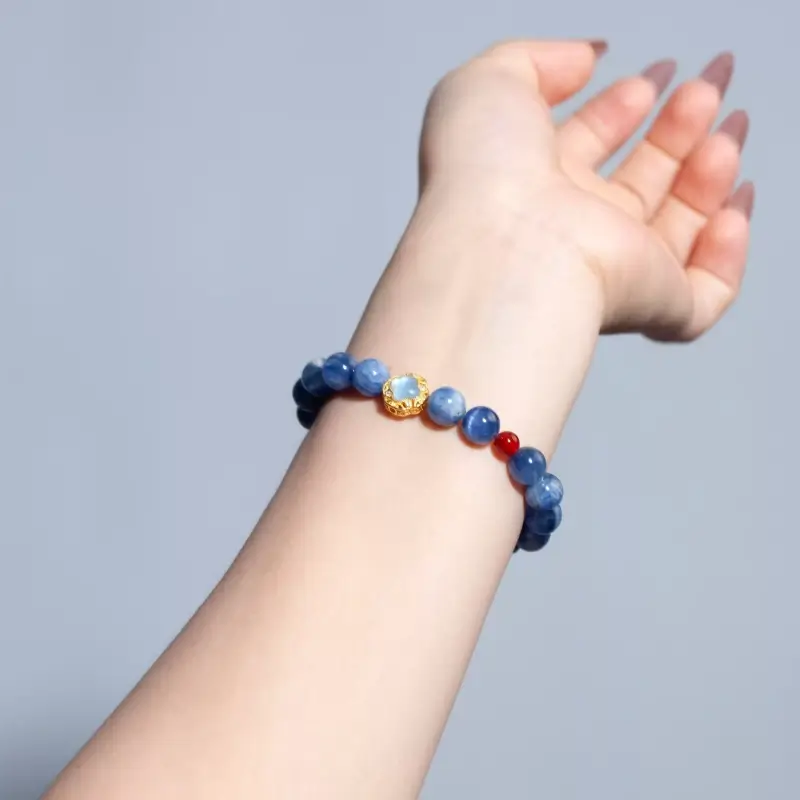 8.8mm Natural Blue Kyanite and Red Agate chakra bracelet on a wrist, featuring S925 silver beads for throat, third eye, heart, and sacral chakra alignment.