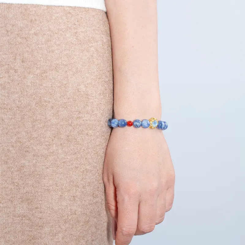 Natural Blue Kyanite and Red Agate bracelet worn during meditation and daily activities, enhancing intuition, passion, and emotional clarity.